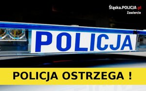 Zdjęcie świetlnego oznakowania radiowozu z niebieskim napisem „policja” na białym tle. Poniżej czarny napis „policja ostrzega !” umieszczony na żółtym pasku.