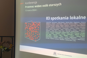 Na zdjęciu widoczny wyświetlony slajd konferencji, transmitowanej w sieci.
